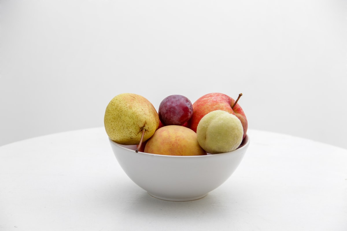Colourful plant-based ingredients including beans, nuts, and vegetables
